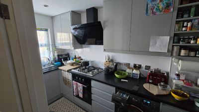 Grey fitted kitchen cabinets and appliances installation