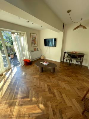 Herringbone parquet flooring in an open-plan living and dining room