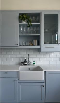 Kitchen flooring installation with natural light from window