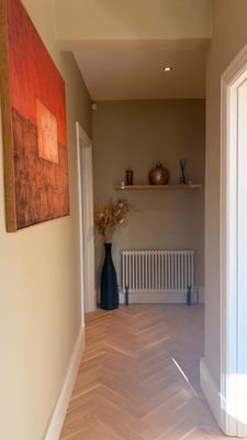 Laminate flooring fitted in a bright empty room with curtains